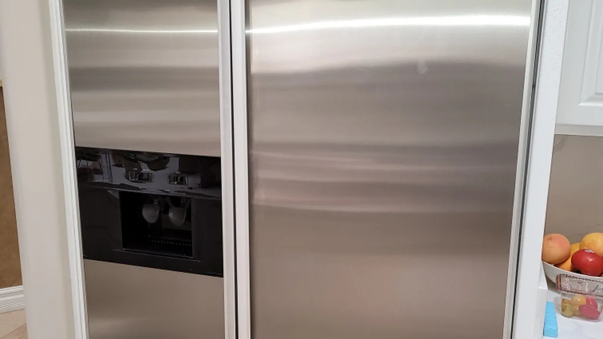 Factory-certified appliance repair technician servicing luxury refrigeration, laundry suites, and cooking ranges in Santa Clara, CA